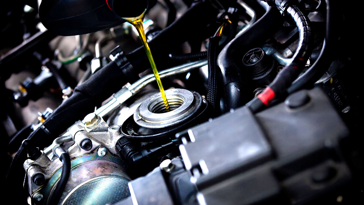 Engine oil being poured into an engine