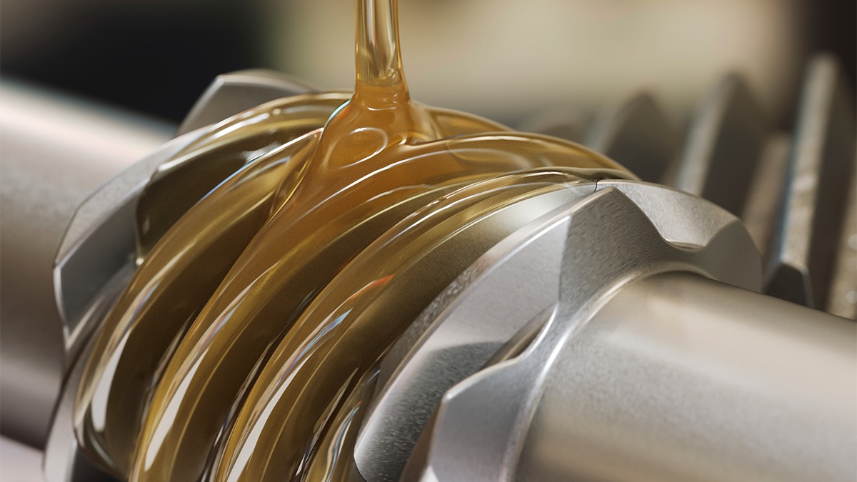 Lubricating oil flowing over metal gears
